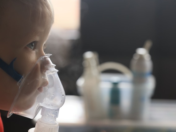 child wearing mask for nebulizer