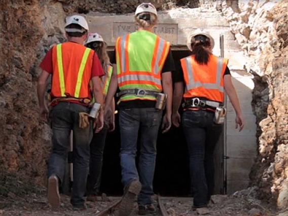 workers walking into a mine