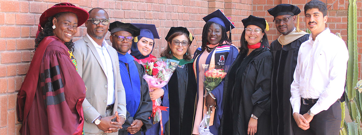 Dean Iman Hakim and MEZCOPH Faculty with visiting GMU MPH Dual Degree graduates and their families