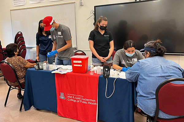 Students giving wellness checks to community members