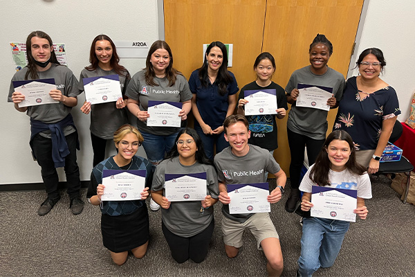 2022 Young Global Leaders group holding their program certificates 