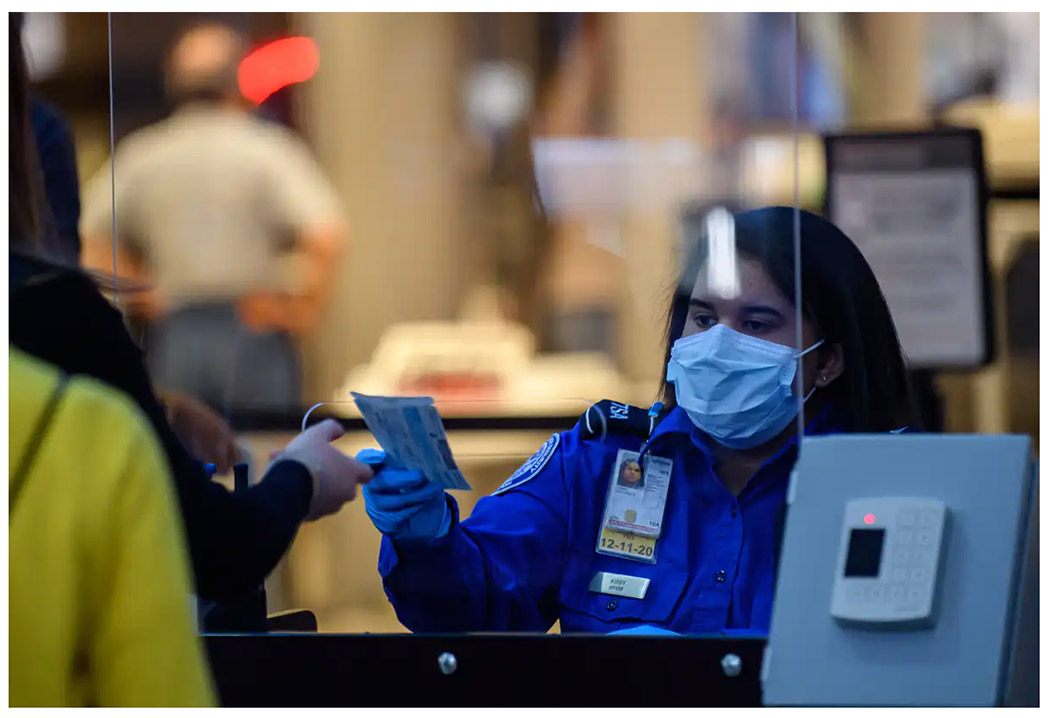 A passenger at Pittsburgh International Airport travels through security 