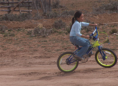 Girl riding a Bike outside