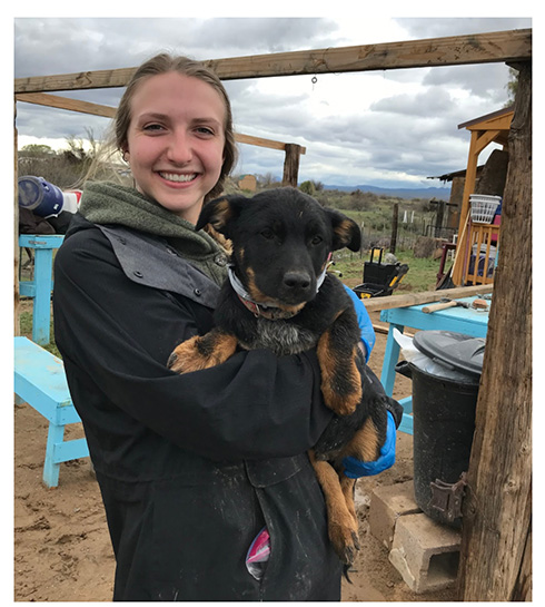 Photo of student holding dog