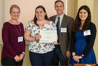 Breanne Lott accepts the award for First place in the Research category.